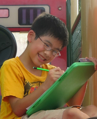 A boy is excited about Math Mammoth