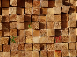 ends of wooden boards that are stacked
